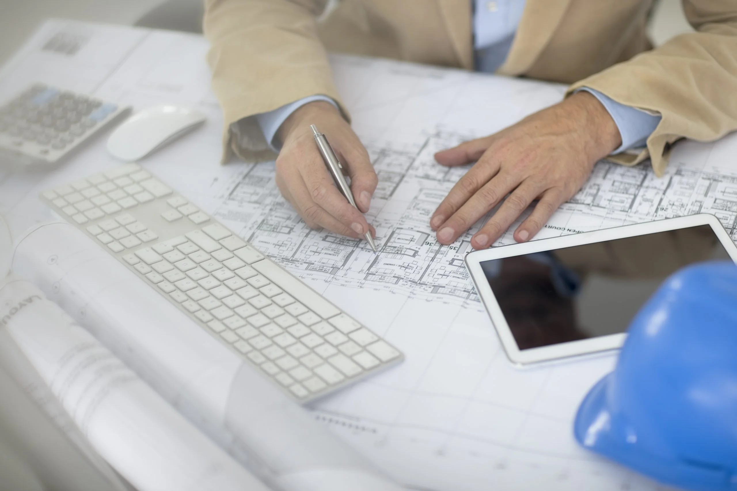 cropped view of man writing on blueprint 2025 04 04 08 33 11 utc
